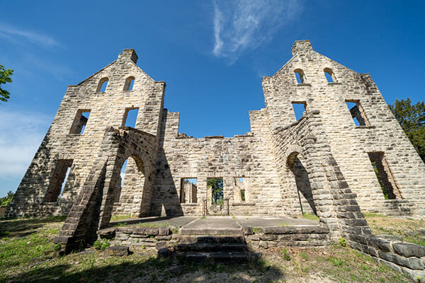 Stone castle ruins at Ha Ha Tonka State Park under a clear blue sky