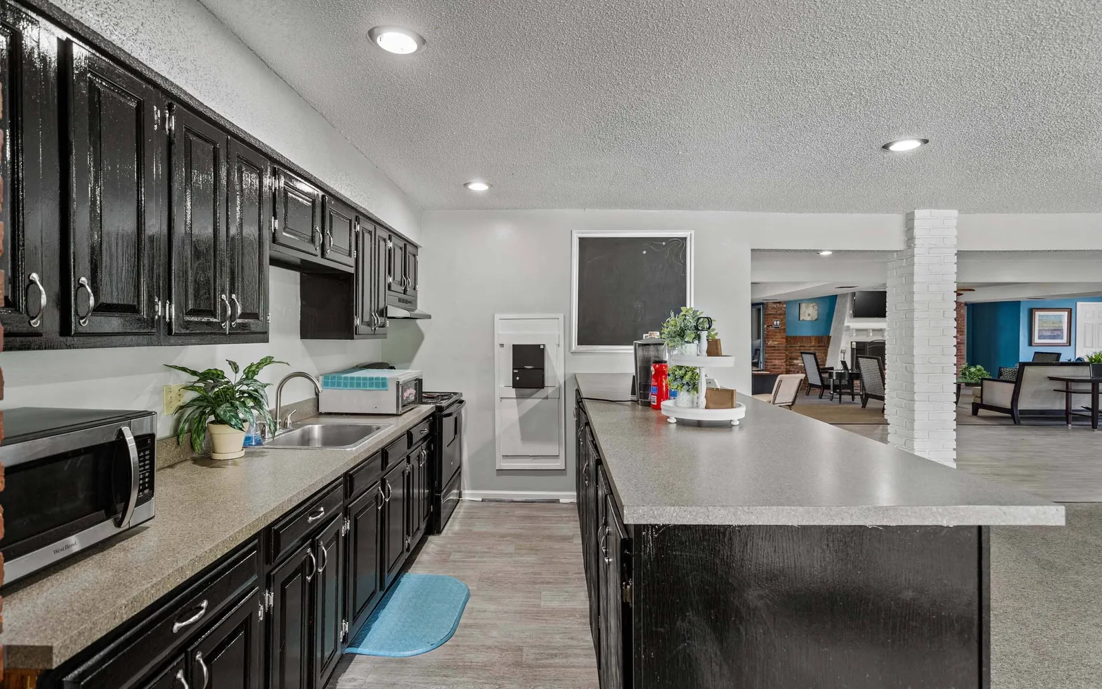 Arbors of Grandview - a clubhouse kitchen with a large island