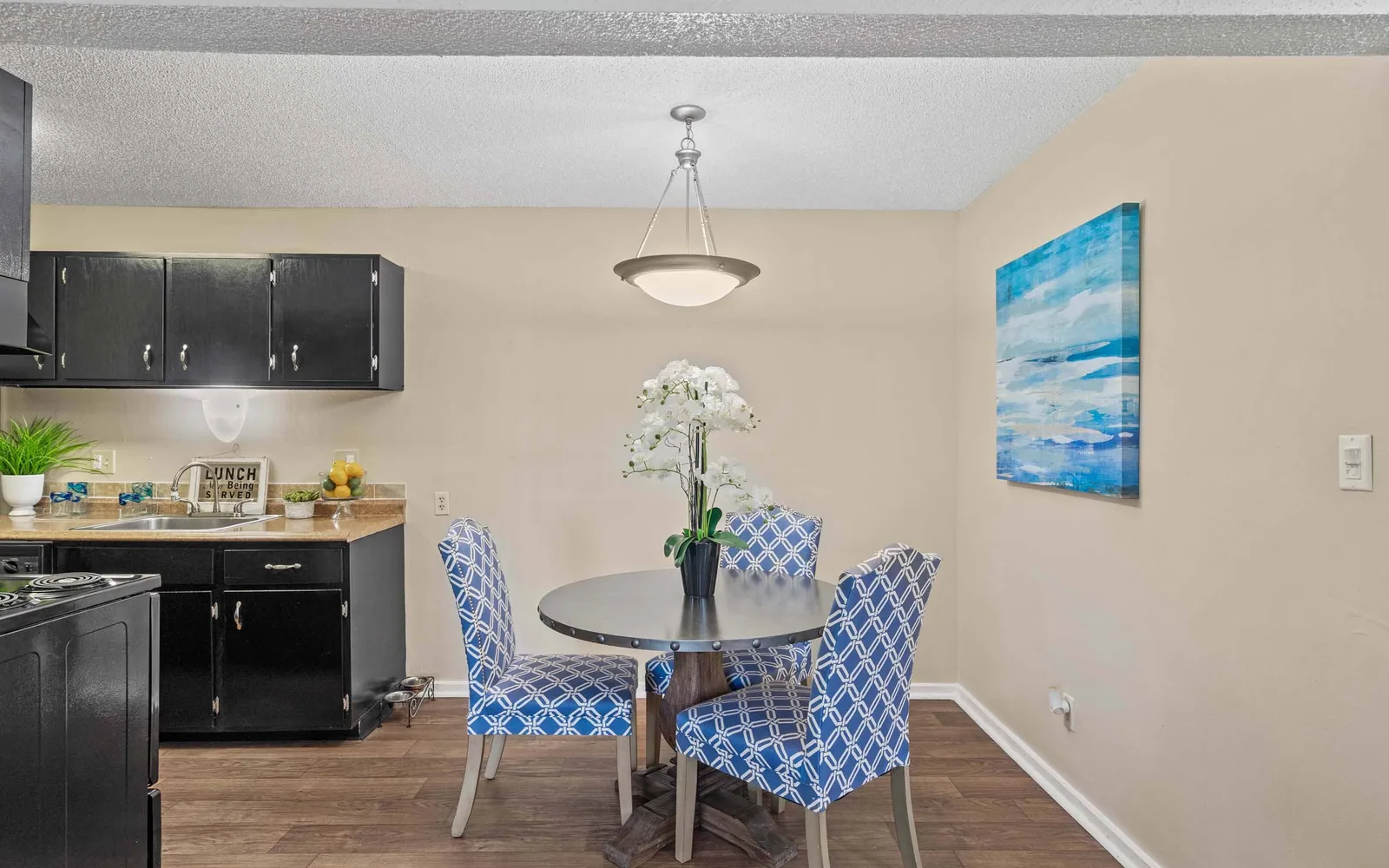 Arbors of Grandview - a dining nook with a table and chairs