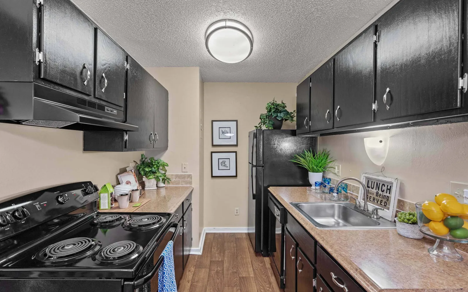 Arbors of Grandview - a kitchen with dark cabinets