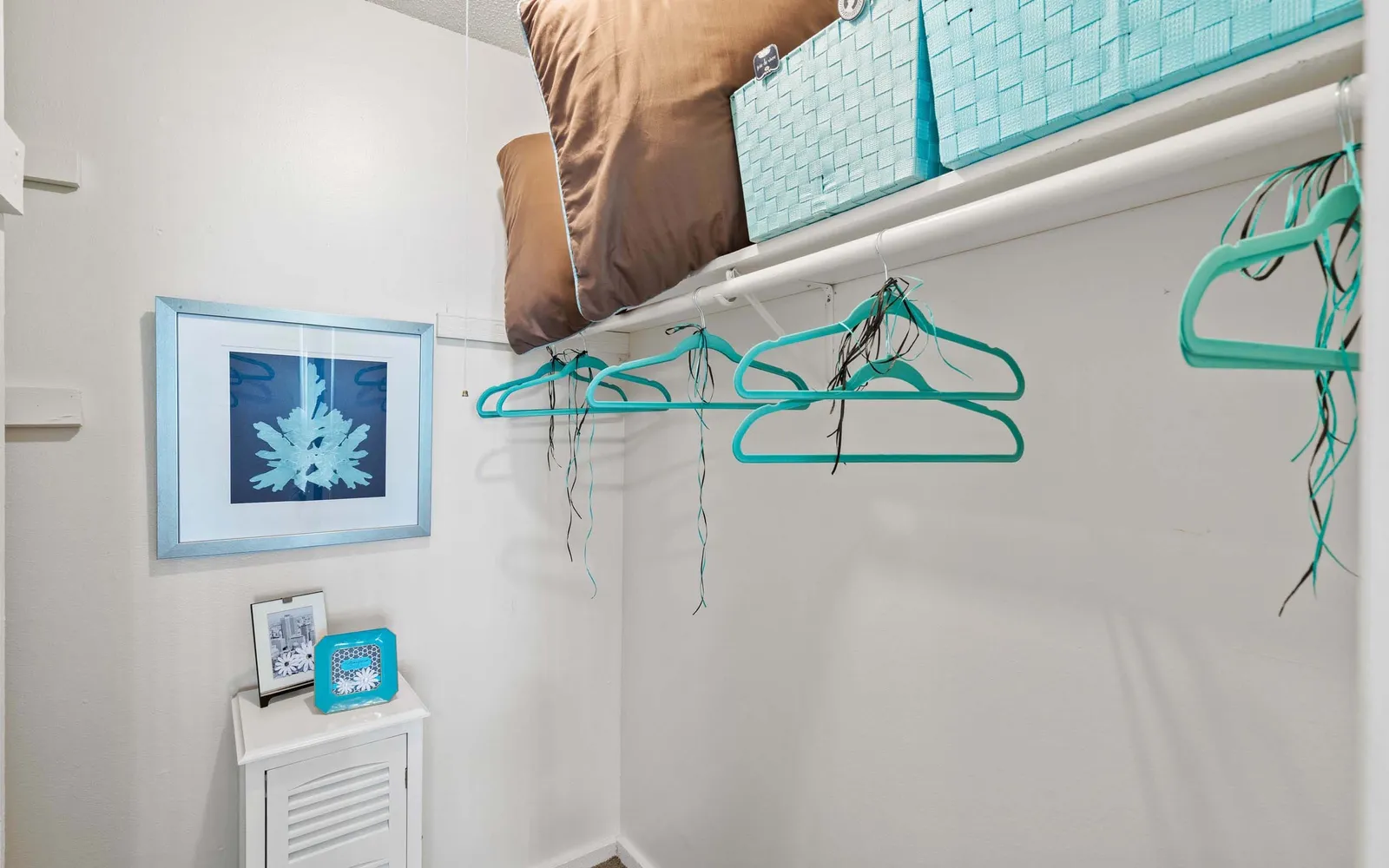 Arbors of Grandview - a closet with hangers and a shelf