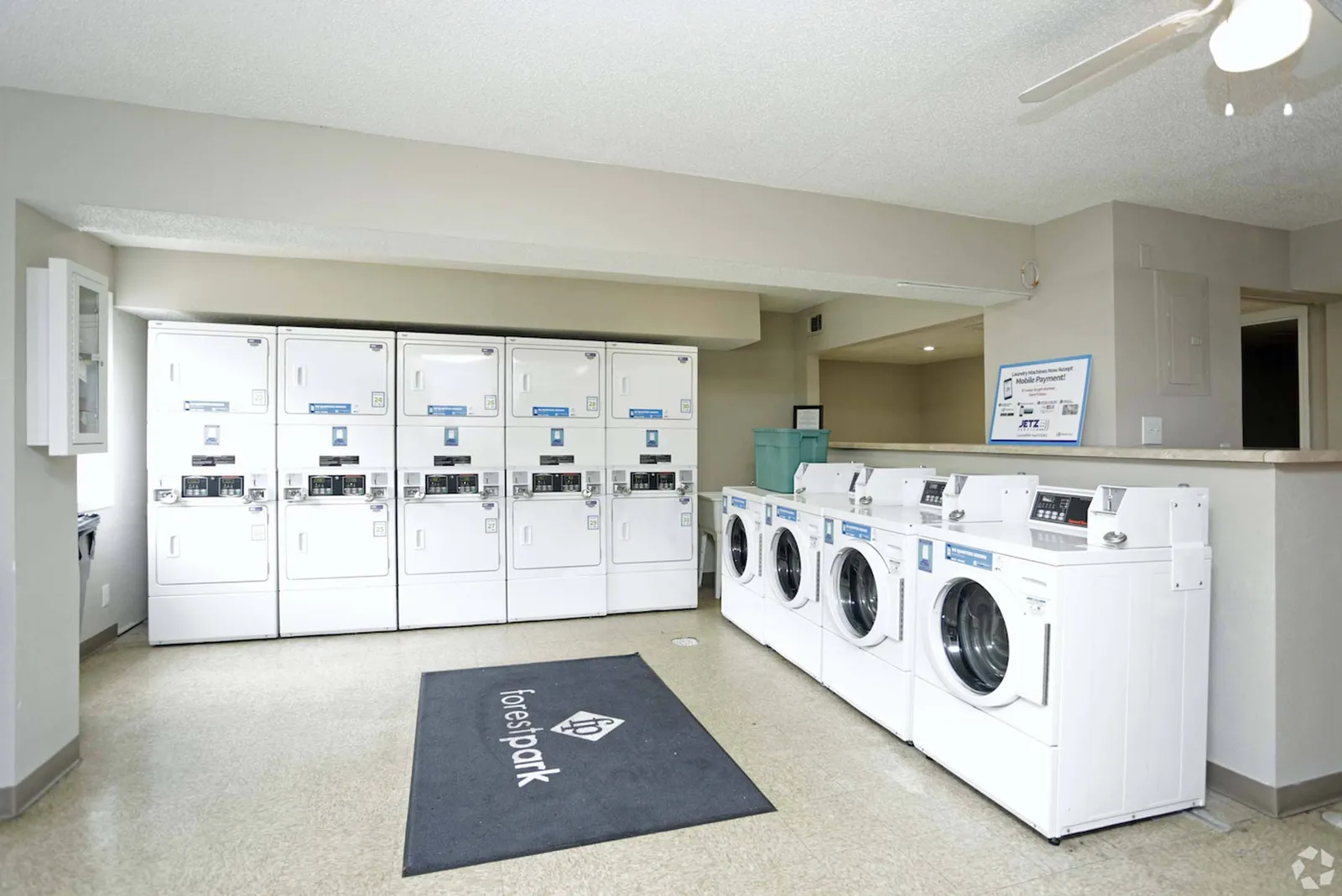 Forest Park Apartments - a room filled with washing and drying machines