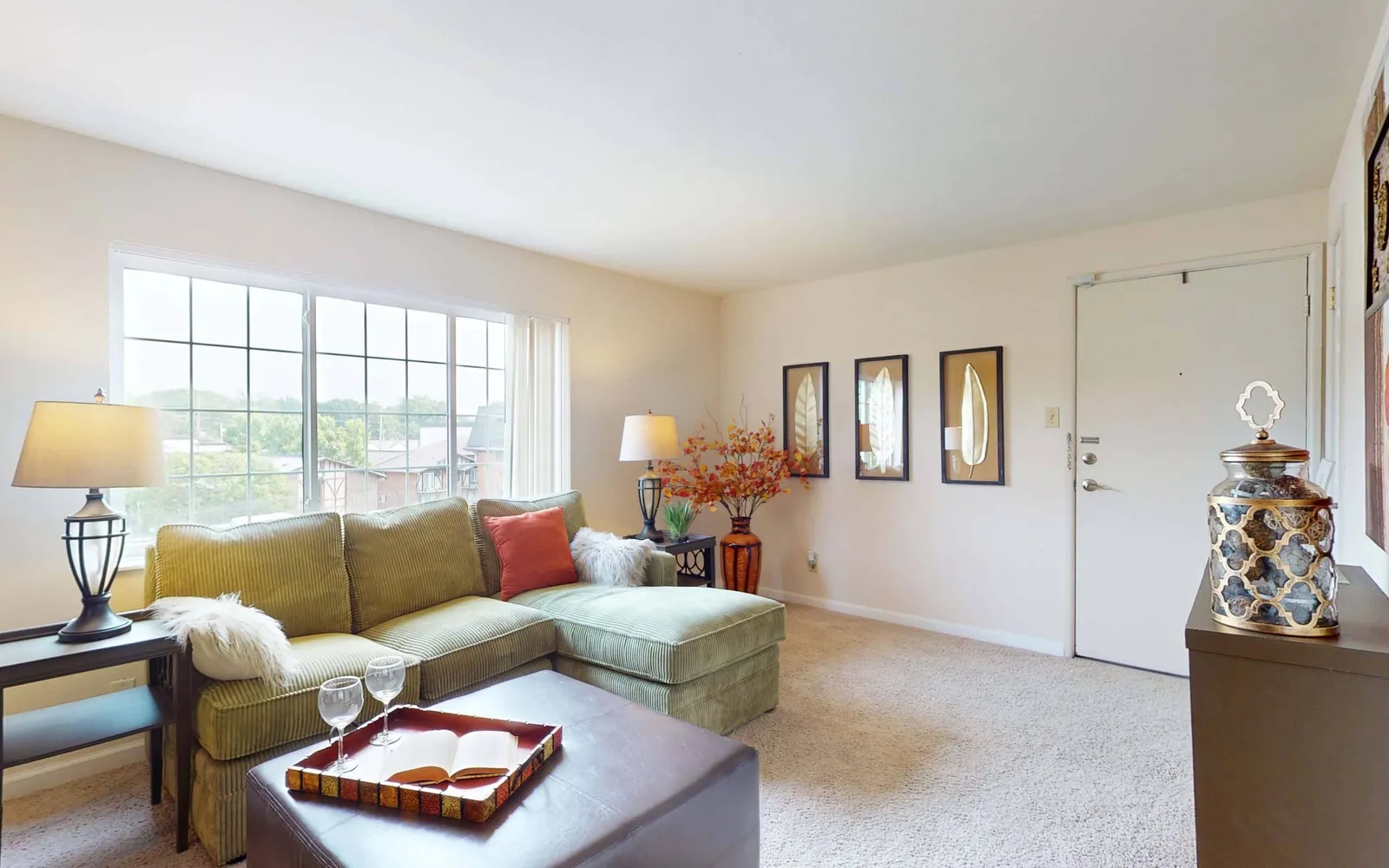 Grant 79 Apartment Homes - a living room with long windows and a couch