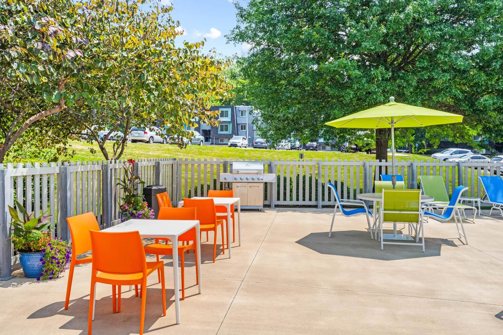 Nori Apartments - a patio with tables and tables