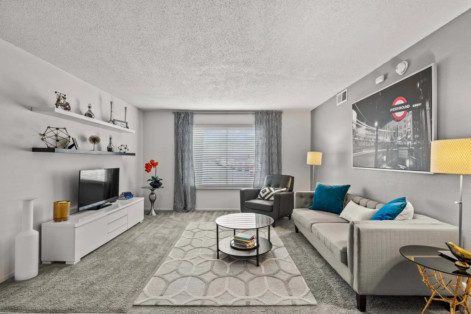 Nori Apartments - a living room with furniture and a window