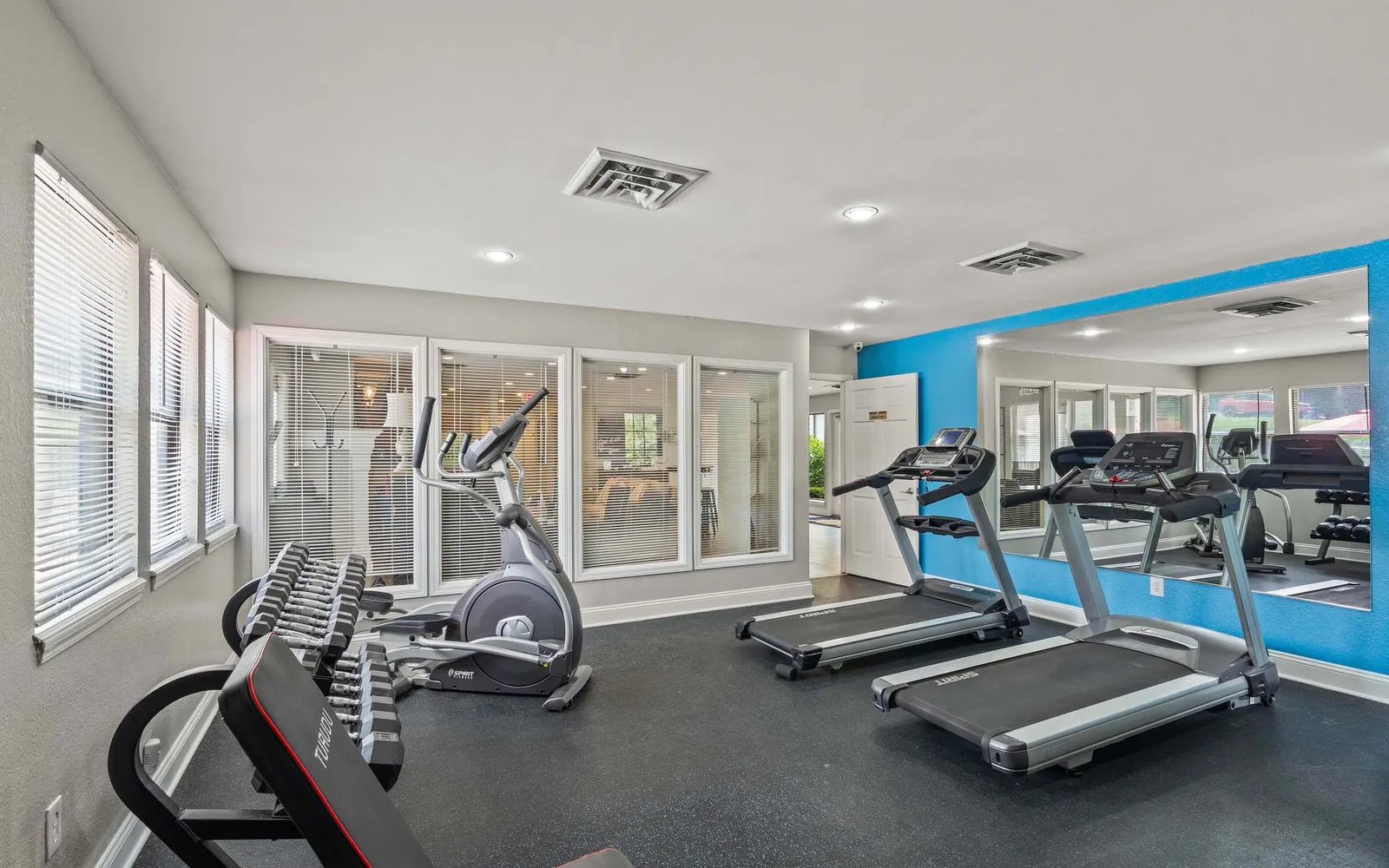 Prairie Walk Apartment Homes - a fitness center with equipment
