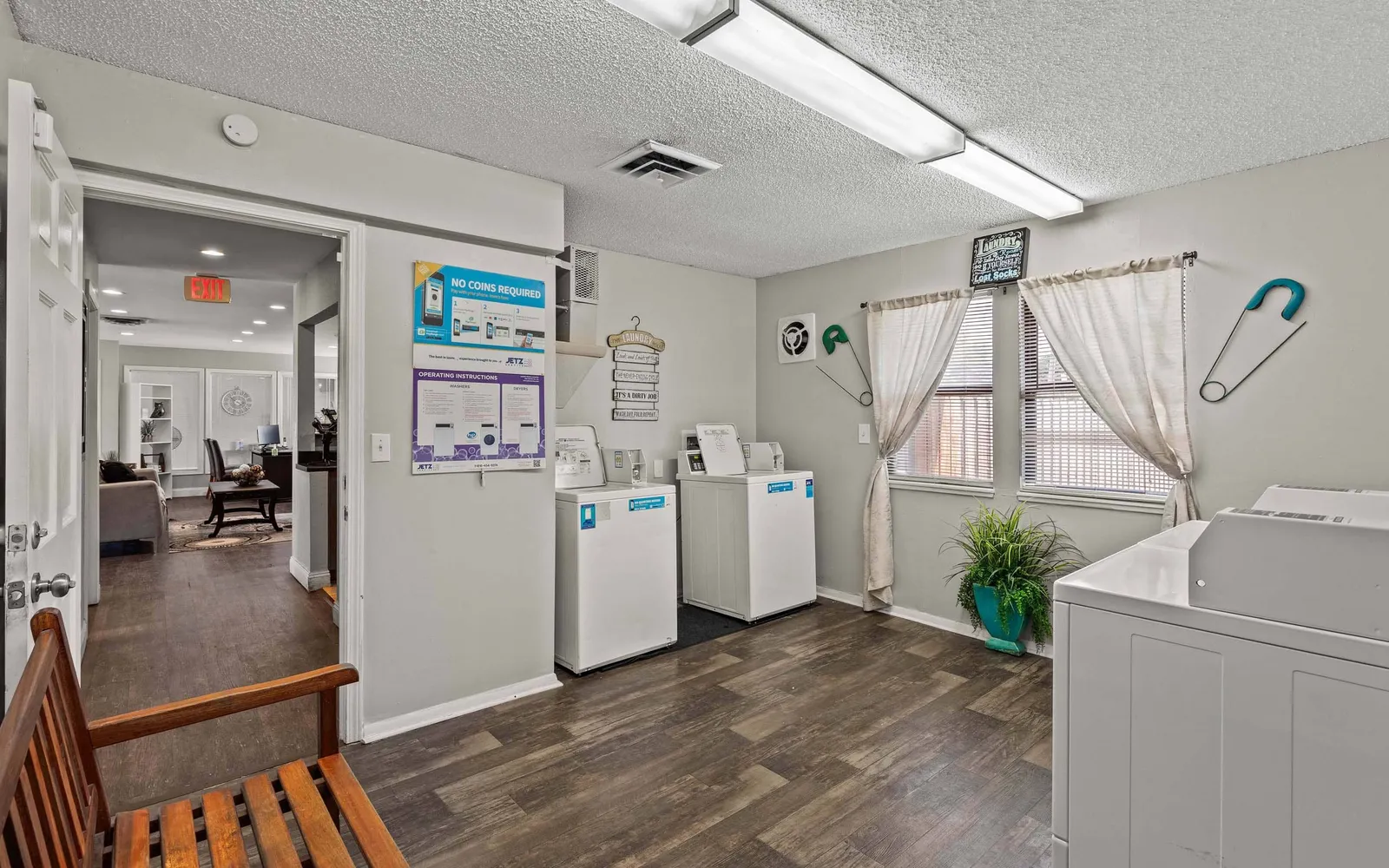 Prairie Walk Apartment Homes - a room with laundry machines