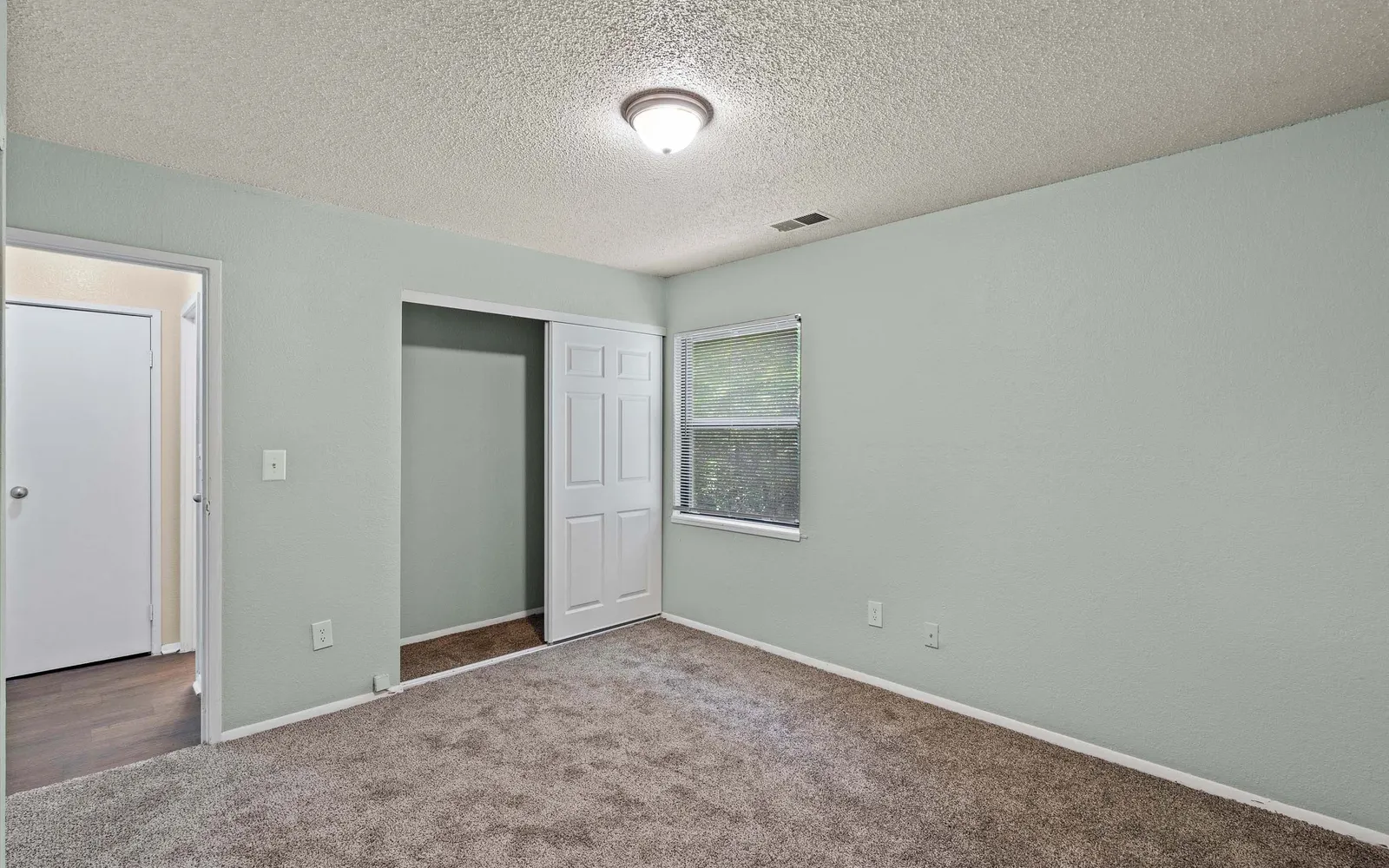 Prairie Walk Apartment Homes - a bedroom with an open closet