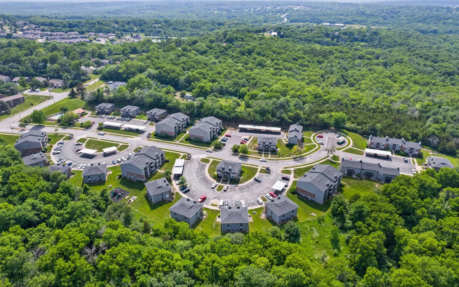 Prairie Walk Apartment Homes - an aerial view of apartments and trees