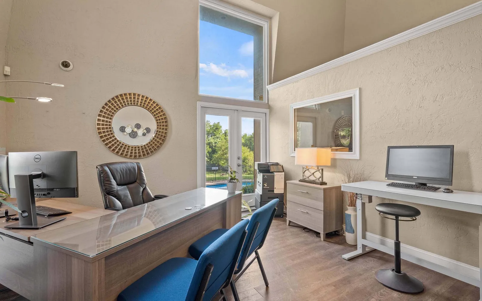 Ridge at Chestnut Apartments - a leasing office with tables, chairs, and computers