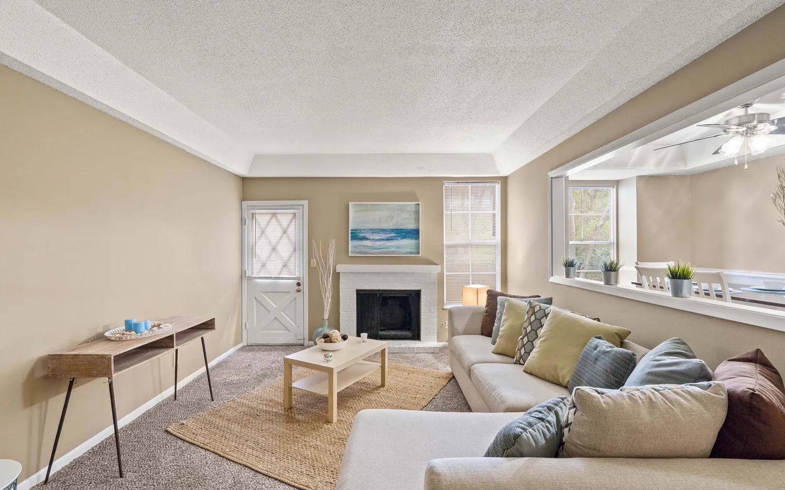 Ridge at Chestnut Apartments - a living room with a fireplace