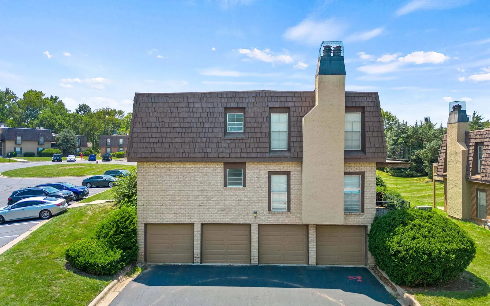 Ridge at Chestnut Apartments - a building with garages beneath it