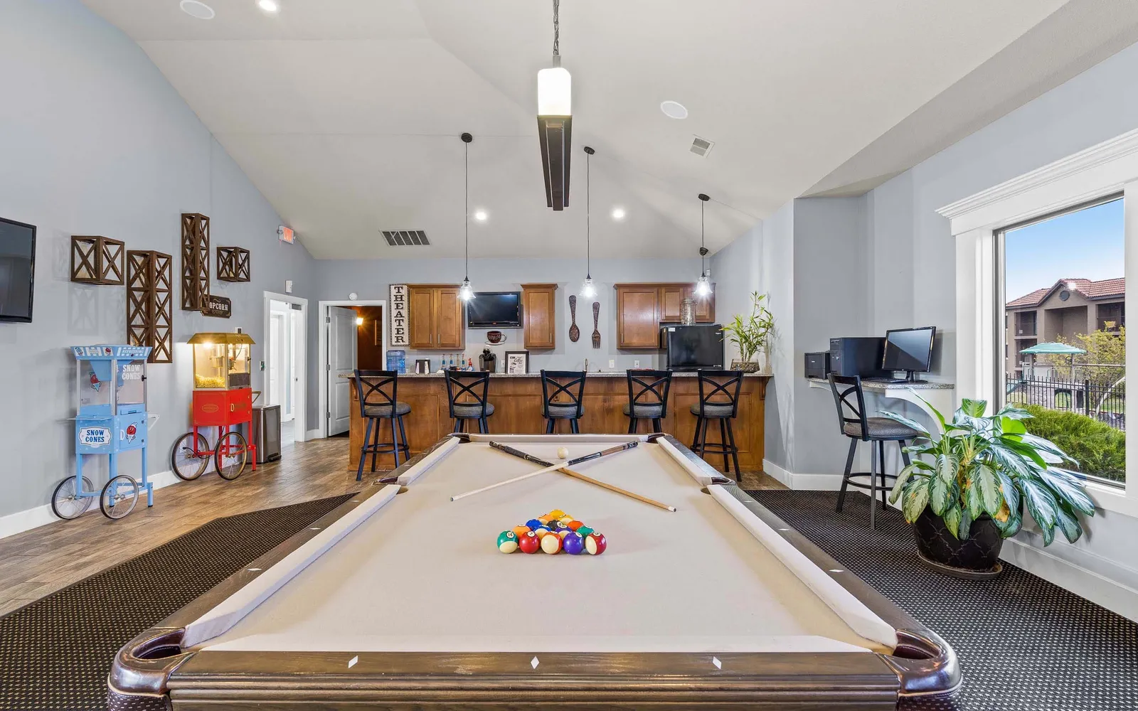 The Hills Apartments - a room with a large billiards table and kitchen