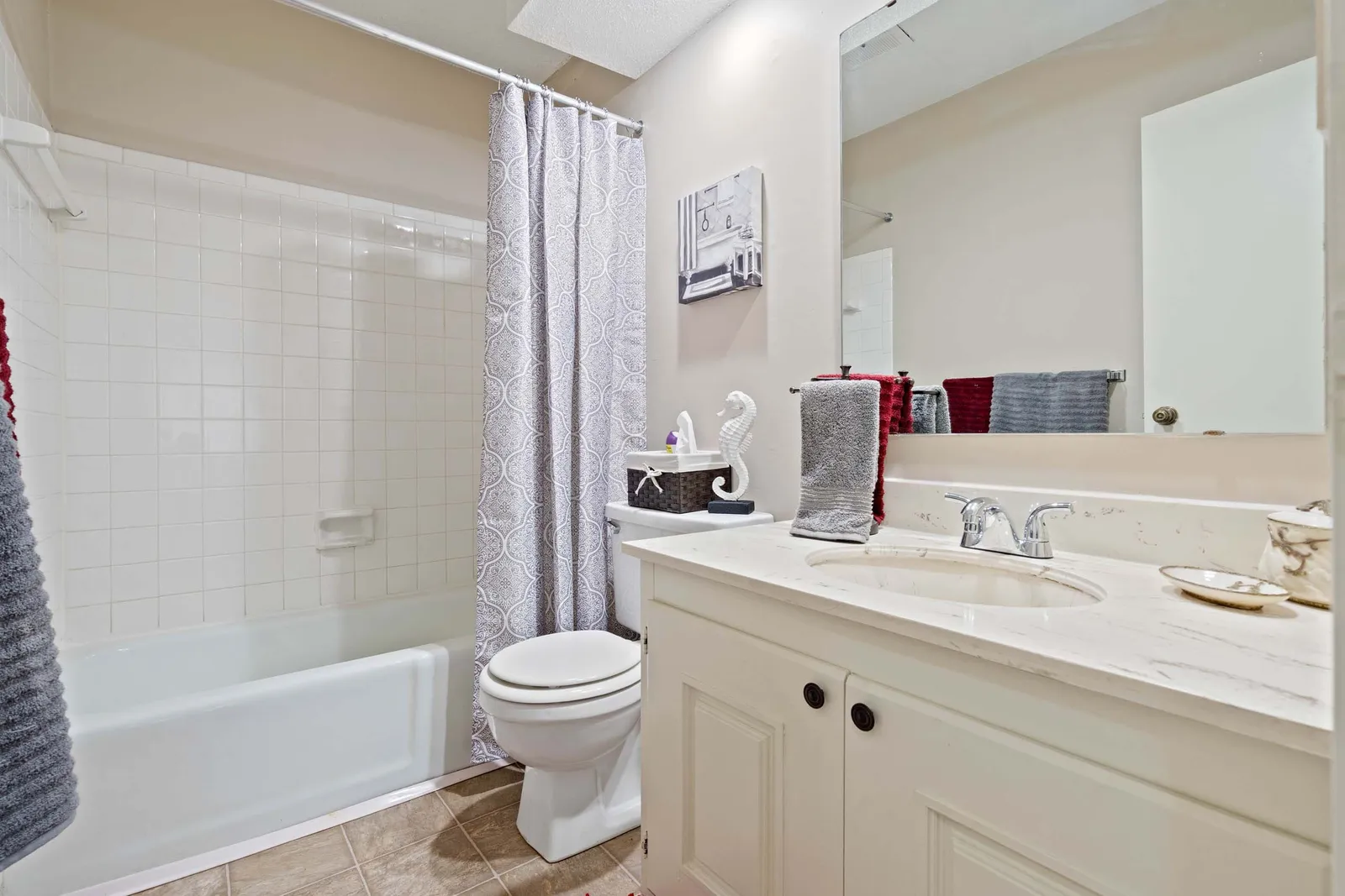 The Oaks at Prairie View - a bathroom with a shower and tub and toilet