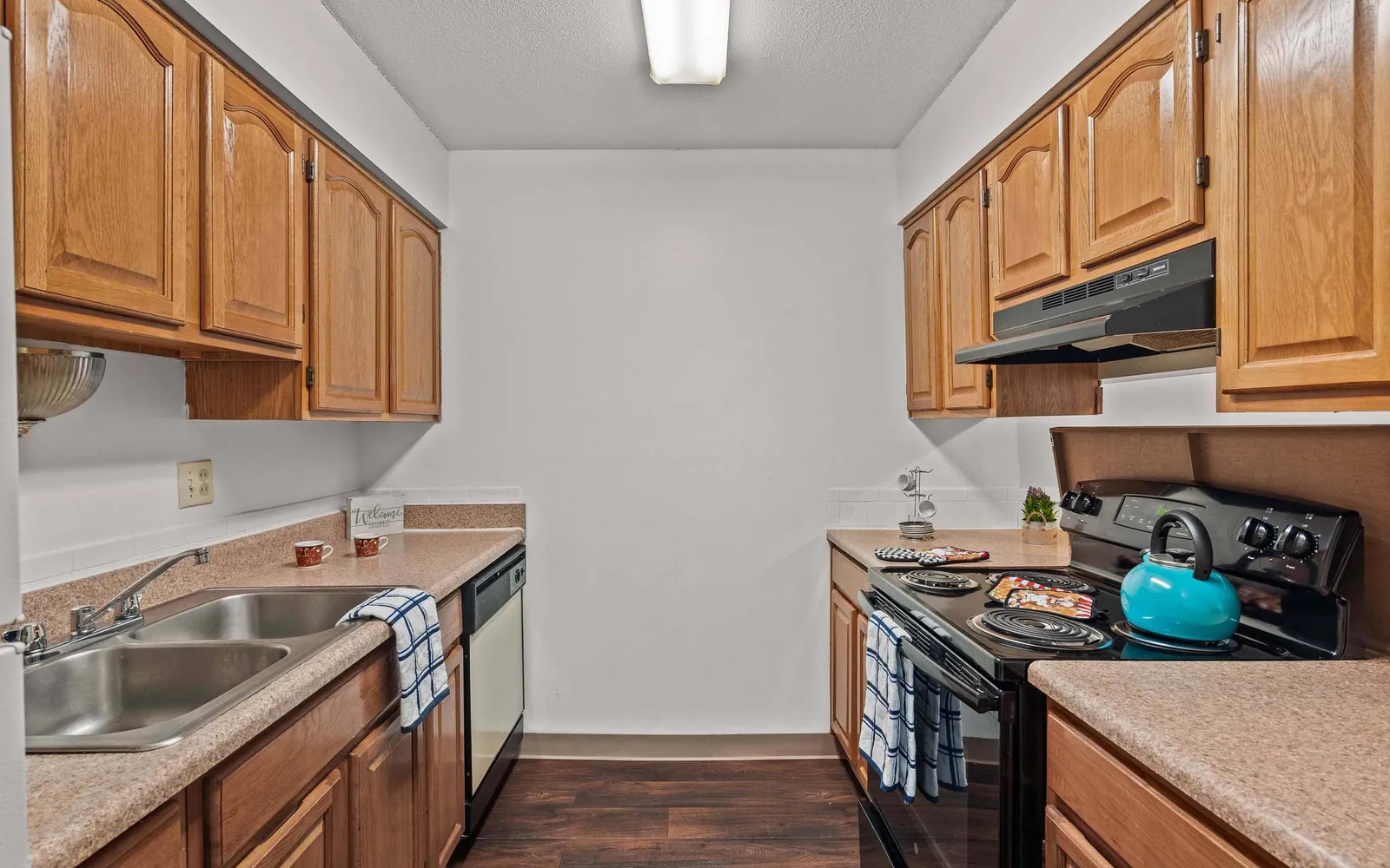 The Retreat at Mill Creek - a kitchen with oak colored cabinets