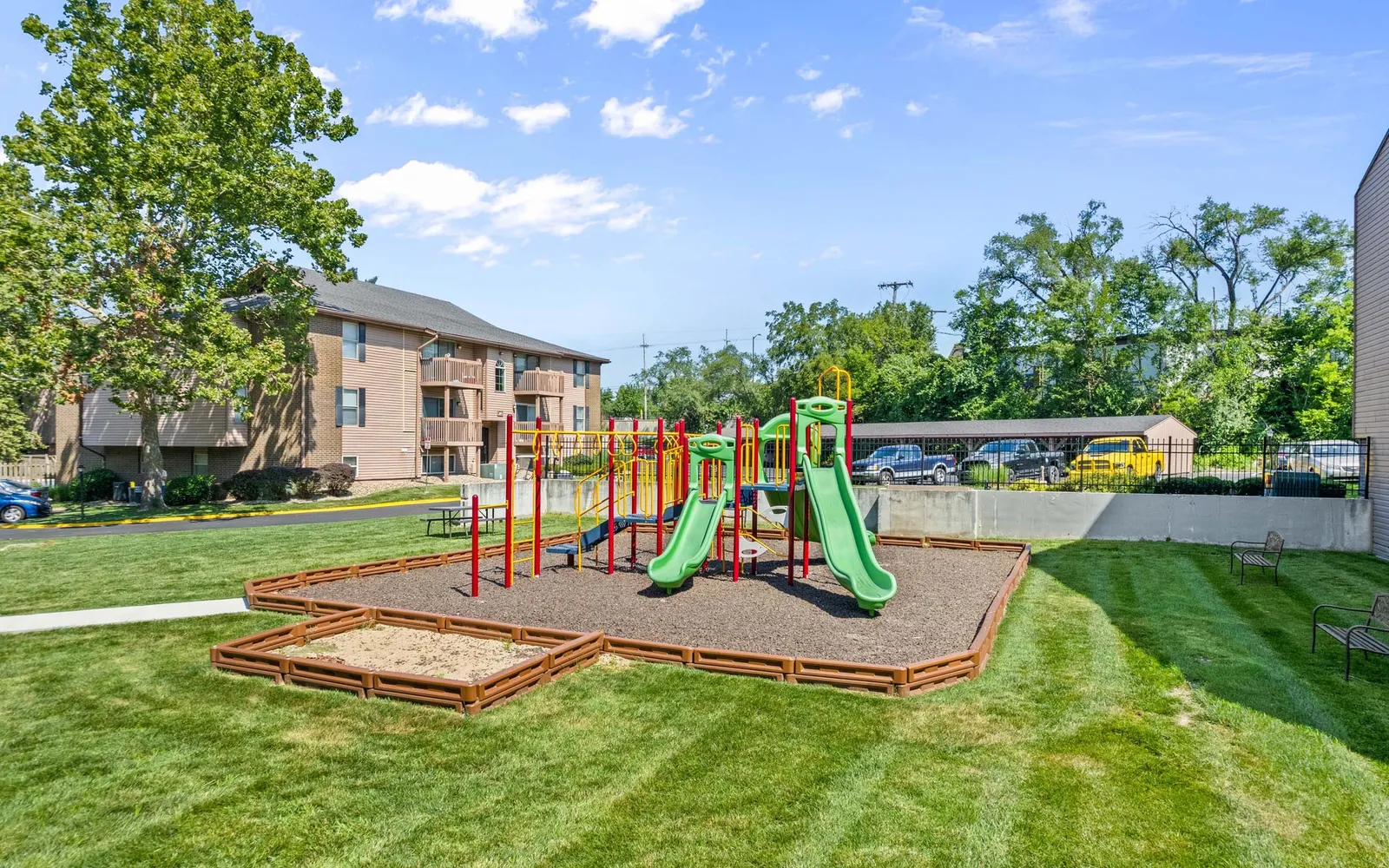 The Retreat at Mill Creek - a playground surrounded by grass and trees