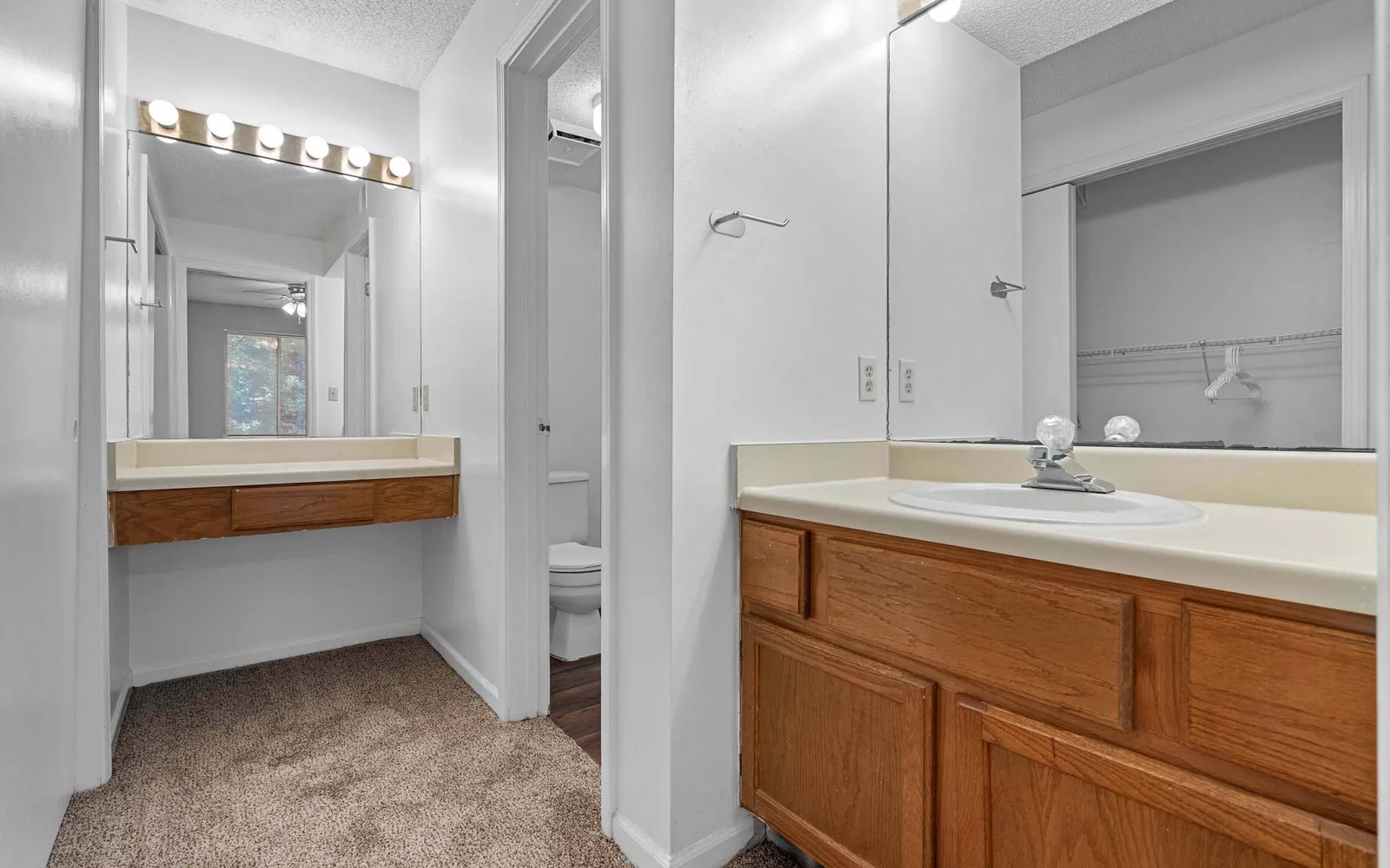 The Retreat at Woodlands - a bathroom with a sink and a separate vanity