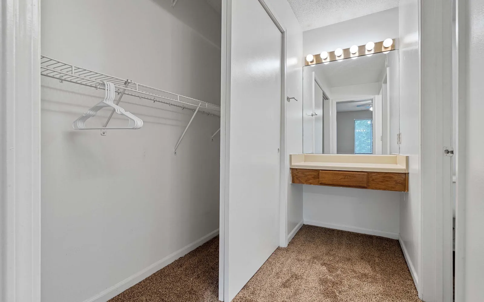 The Retreat at Woodlands - a closet and a vanity