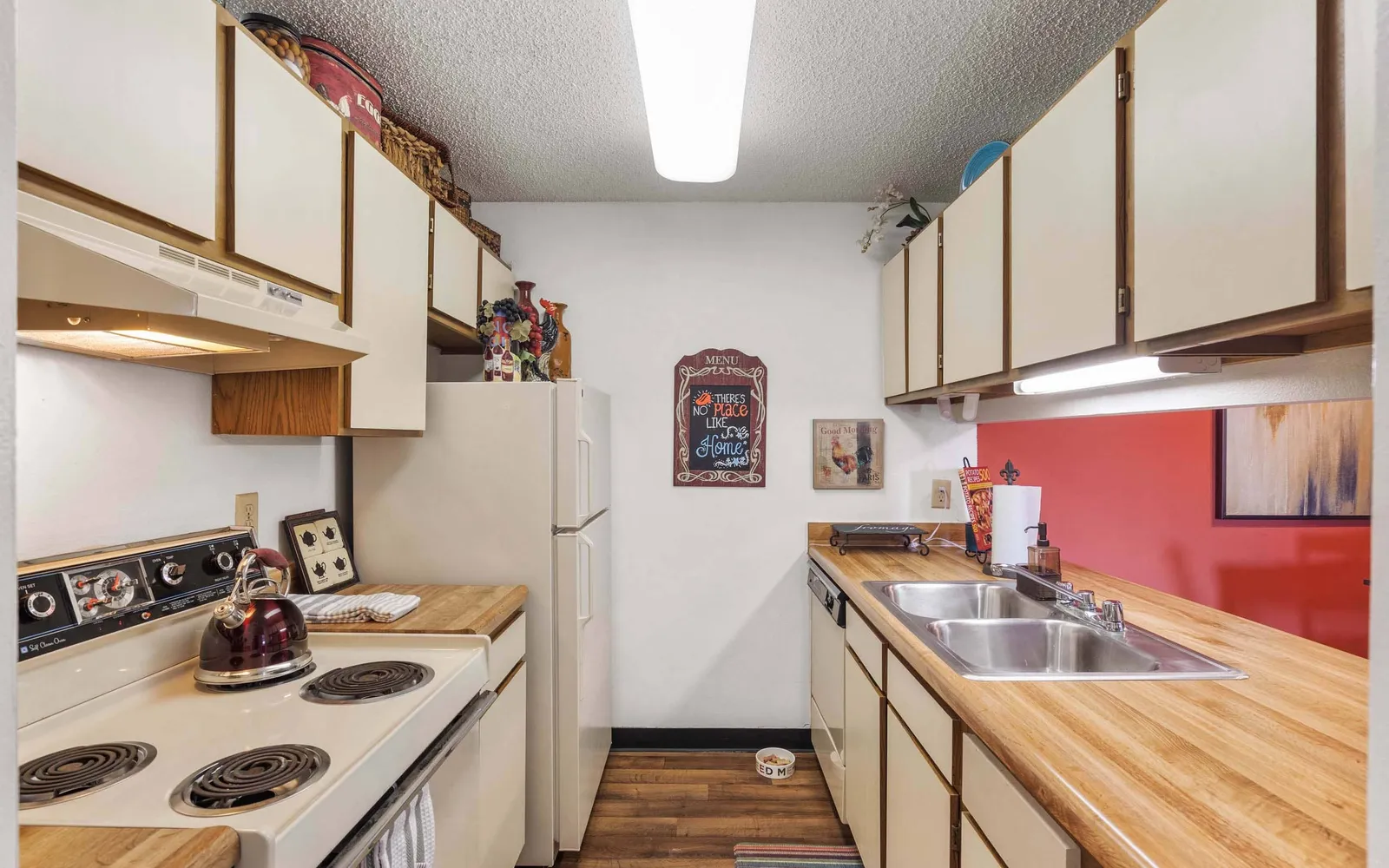 The Retreat at Woodridge - a kitchen with white cabinets